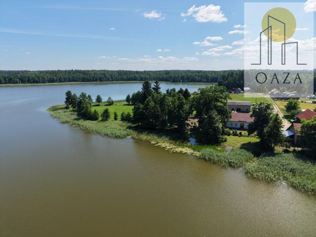 Polecam rozległe gospodarstwo 200 m² z 14 ha i 900 m linii jeziora