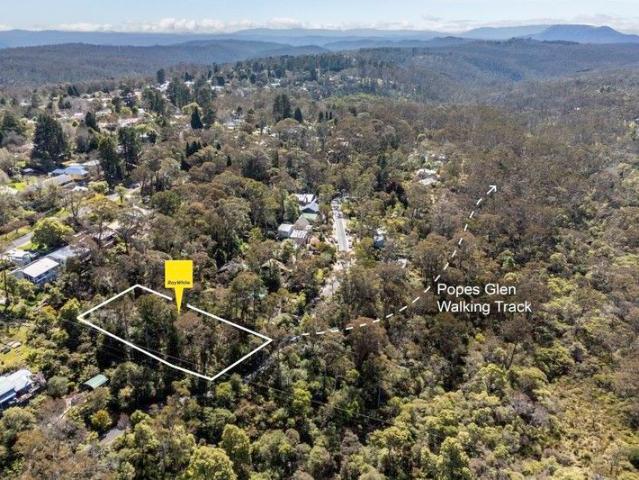 POSITIONED OVERLOOKING POPE'S GLEN RESERVE