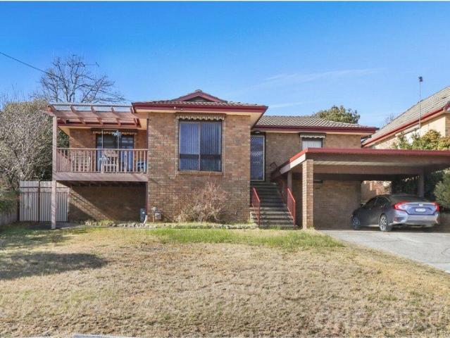Positioned in the elevated pocket of East Grove, this solid 3 bedroom brick home offers sweeping outlooks from a private balcony