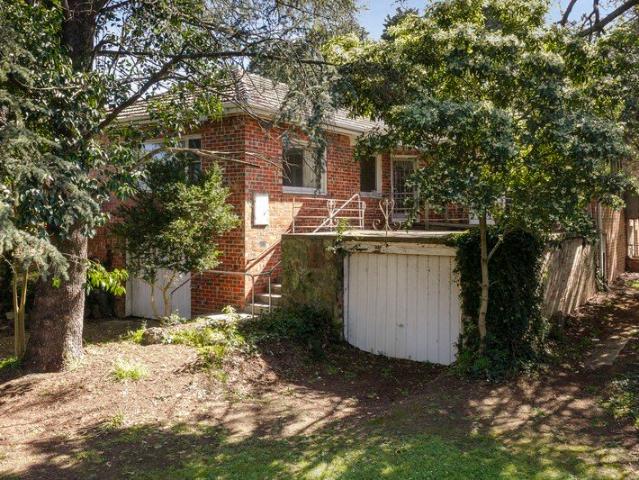 Potential Filled Brick Home in Serene Locale