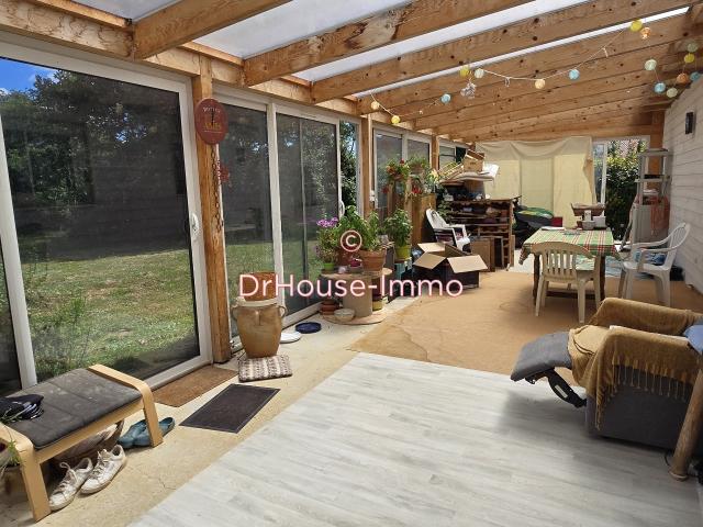POUILLE Maison en bois récente de plain pied 3 chambres lumineuse DPE en B Magnifique terrain de 3.090 m2 Véranda et Garage