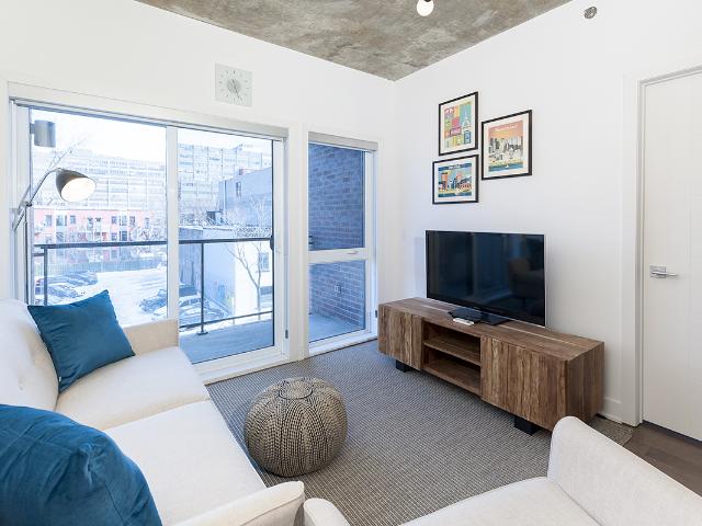 Plateau Mont Royal Furnished Condo Rental at Le Milieu – Fresh 1 Bedroom Rental with Exposed Concrete Ceilings and Hi End Appliances