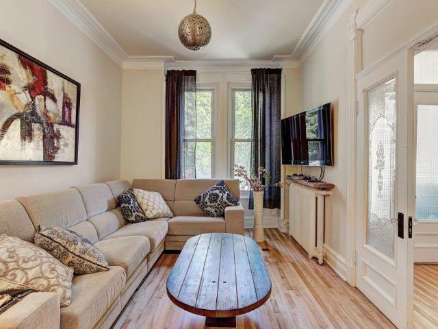 Plateau Mont Royal Furnished Townhouse Rental on Rue Saint Hubert Elegant 3 Bedroom Townhouse with Parking and Private Garden