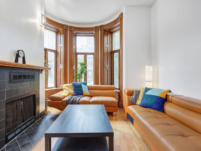 Plateau Mont Royal Montreal Furnished Townhouse Rental on Prince Arthur Street Charming 4 Bedroom, 2 Bath with Beautiful Interior and Fireplace