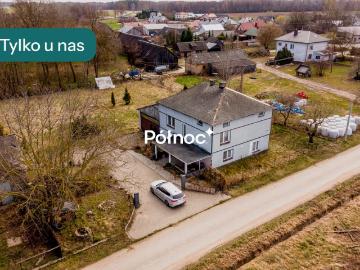 Dom z dużym terenem i zabudowaniami gospodarczymi