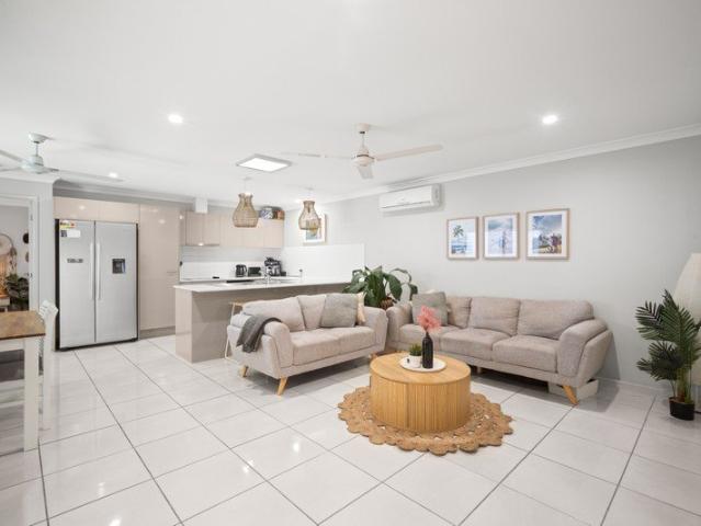 Properly Managed I Stylish, Easy Care Living in a Sought After Forest Glen Location