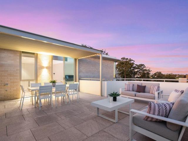 Premier Top Floor Residence with Expansive Outdoor Living and Skyline Views