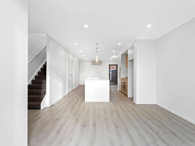 PREMIUM NORTH FACING TWO BEDROOM HOME Within 5 minutes walk to Schofields Train Station!