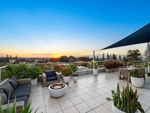 Premium resort style living at popular Town Beach