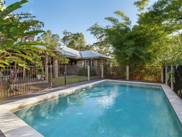 Prestige Acreage Living in Exclusive Forest Ridge Estate