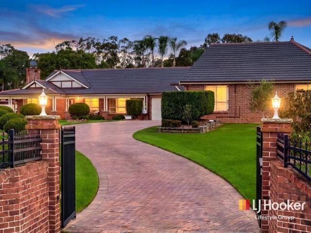 Prestigious 2.5 Acre Estate with Dual Living