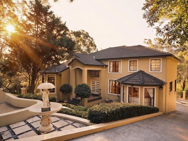 Prestigious Three Level Family Residence in a Private Bushland Setting