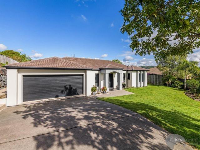 PRESTIGIOUS PACIFIC PINES FAMILY SANCTUARY ON 1,150m² WITH STUNNING HINTERLAND VIEWS