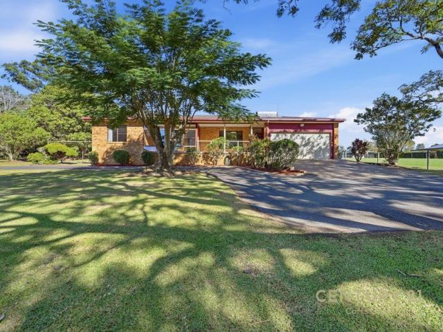 Privacy, Potential & Peaceful Acreage Living in Prestigious Bonville