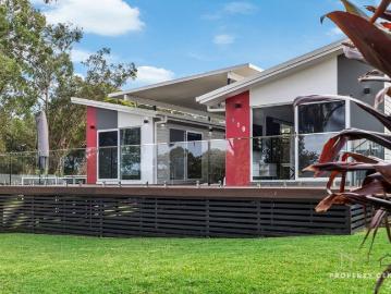 PRIVATE, MODERN & LOW MAINTENANCE A TITAN BUILT STANDOUT HOME
