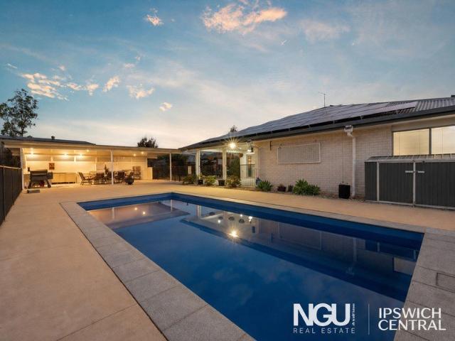 PRIVATE ACREAGE ENTERTAINER WITH POOL HOUSE, SHED, SOLAR & RESORT STYLE OUTDOOR LIVING!