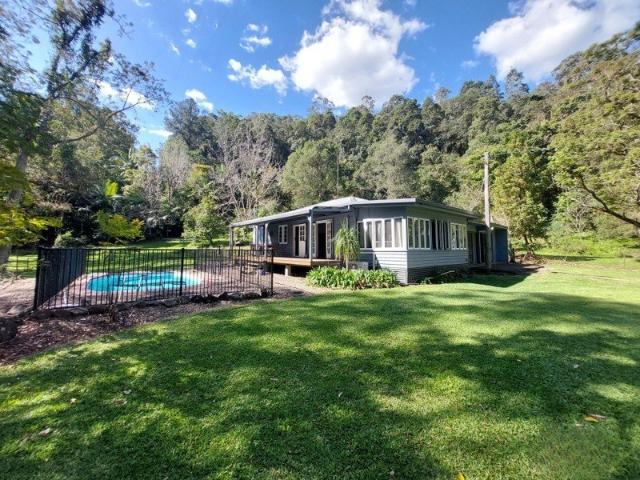 Private Acreage Oasis with Picturesque Tree Lined Surrounds