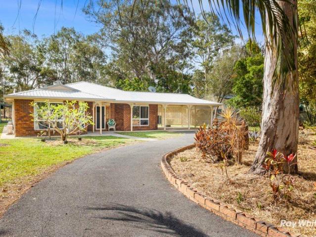 PRIVATE ACREAGE LIVING WITH BEAUTIFUL ESTABLISHED GARDENS