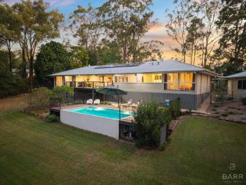Private Acreage Paradise with Designer Renovation & Resort Style Pool Living