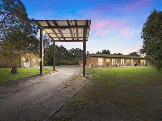 Private Acreage Paradise with Endless Family Appeal