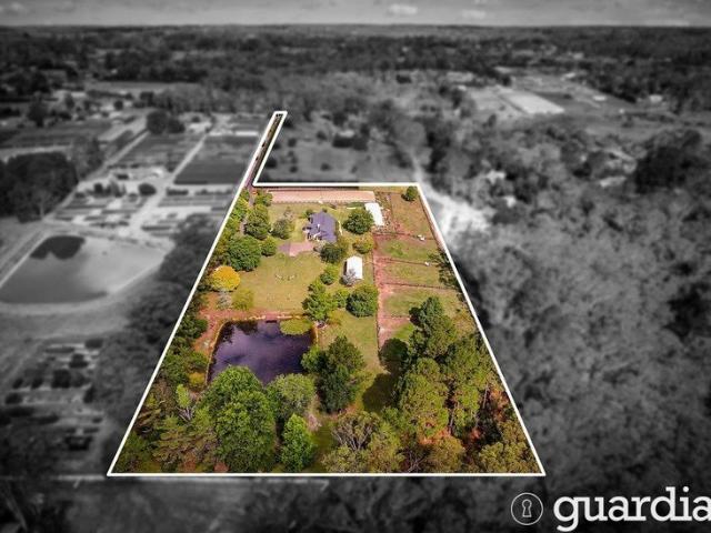Private acreage with equestrian facilities