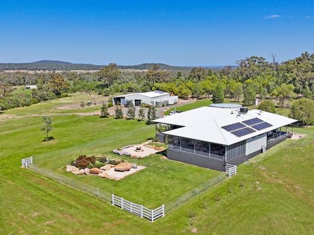 STUNNING DESIGNER RESIDENCE ON ACREAGE WITH PANORAMIC VIEWS