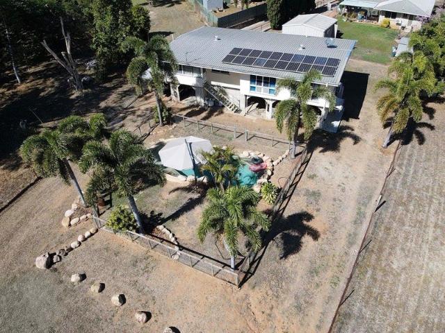 Private Family Oasis on 1,855m² Spacious High Set Home with Pool & Powered Shed