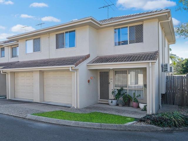Private, Low Maintenance Living Surrounded by Parkland