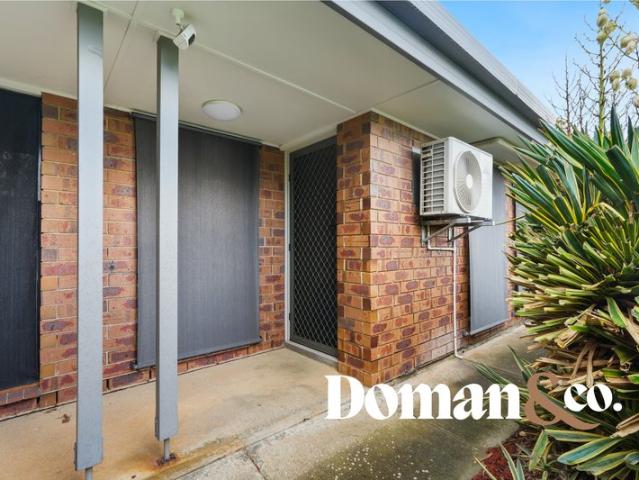 Private, Low Maintenance Living with a Backyard to Enjoy
