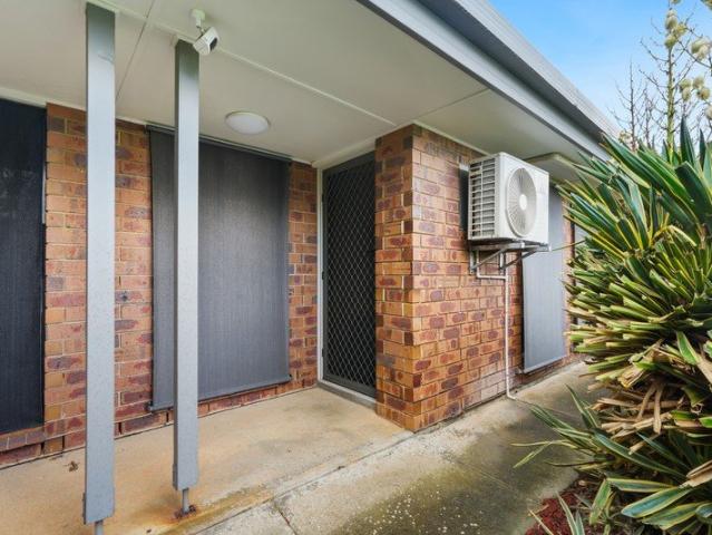 Private, Low Maintenance Living with a Backyard to Enjoy