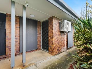 Private, Low Maintenance Living with a Backyard to Enjoy