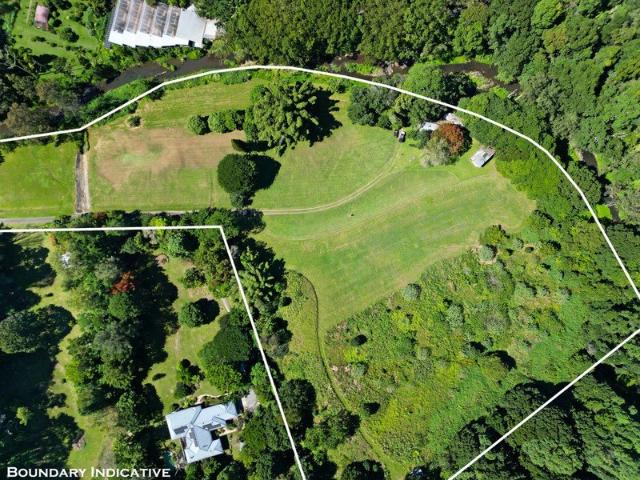 Private, Picturesque Acreage Featuring a Charming Caretaker's Cottage and Endless Potential