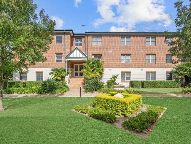 Tranquil Garden Apartment in Exclusive Waterfront Community