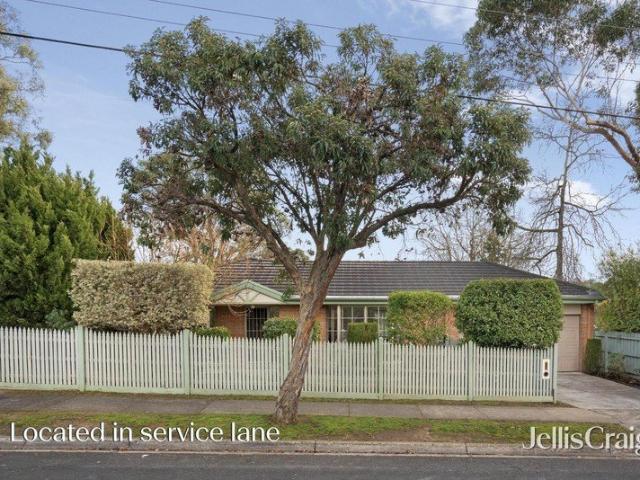 Private single level home with spacious north facing deck and garden
