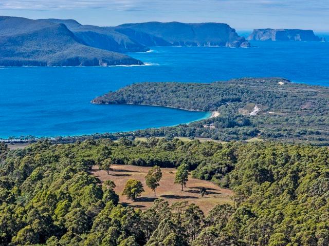 Private Wilderness Retreat with Breathtaking Water Views Over 50 Acres Adjoining National Park
