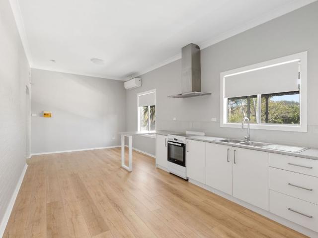 Private 1 Bedroom Flat with Main Street Location and carport