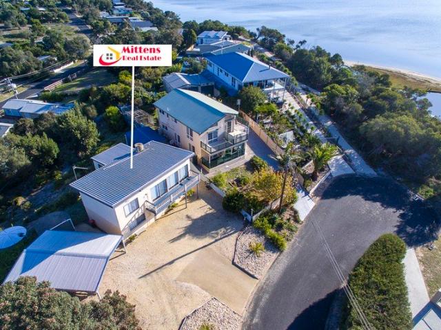 Prime Location with Spectacular Water Views Plus Versatile Residence