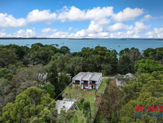 Prime Main Beach Development Opportunity | 3,588m² with MDR Zoning | Block of 3 Townhouses | 50m to Beach & Jetty