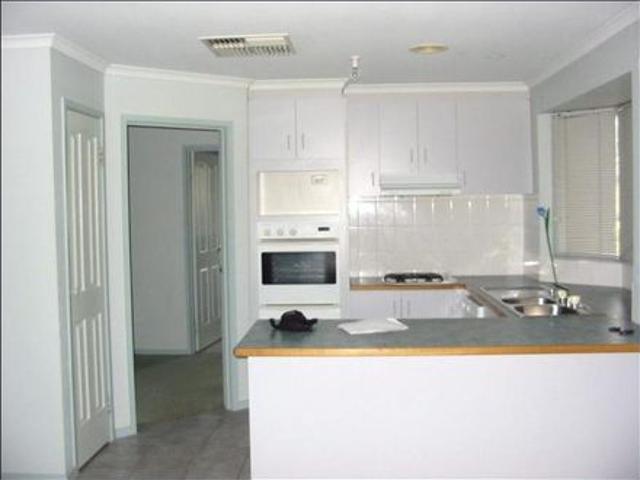 PRIMELY LOCATED FOUR BEDROOM FAMILY HOME!