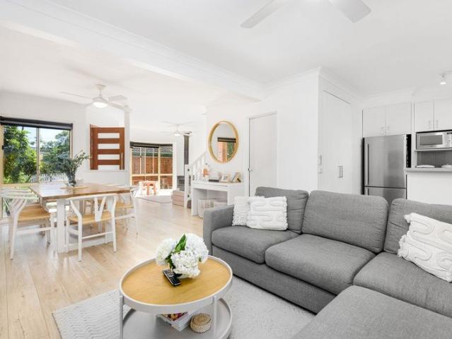 Pristine townhome with entertaining deck and level lawn