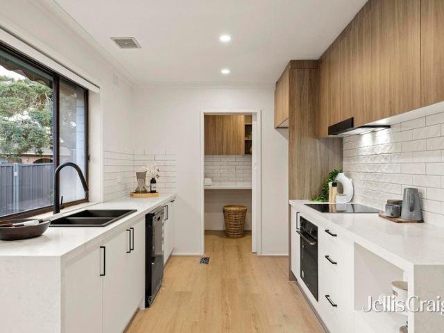 Pristine contemporary updates with exceptional family entertaining spaces
