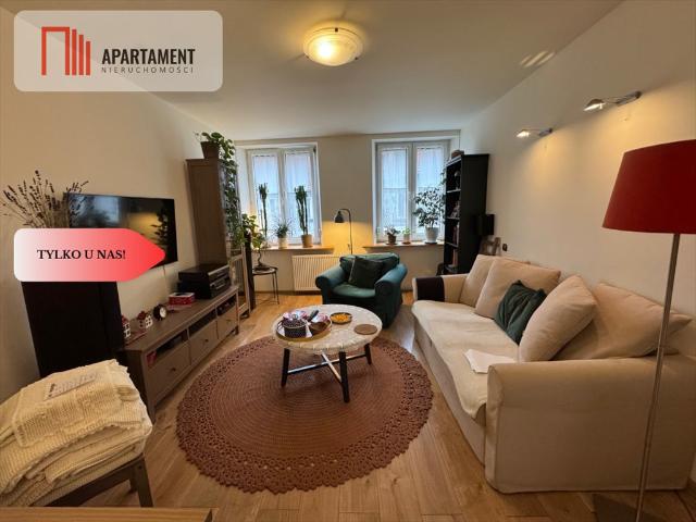 Polecam przestronne 60 m² mieszkanie z garażem i działką