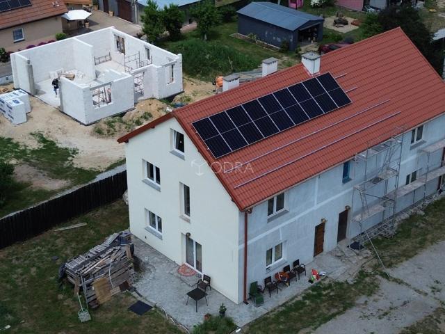 Przestronny dom z fotowoltaiką, 2 adresami i dużą działką