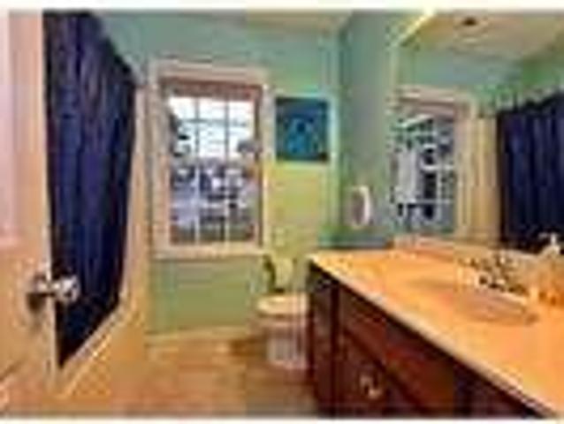 Pull into the driveway and up to the two car garage. $950/mo