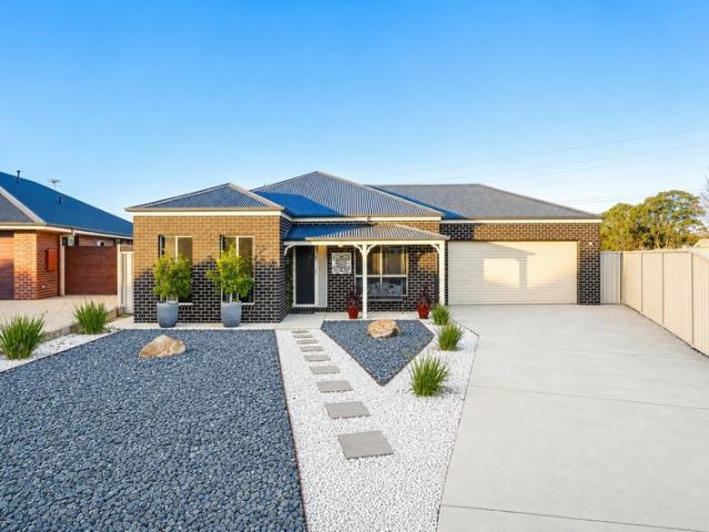Quality Built Family Living with Space, Style & Everyday Comfort!