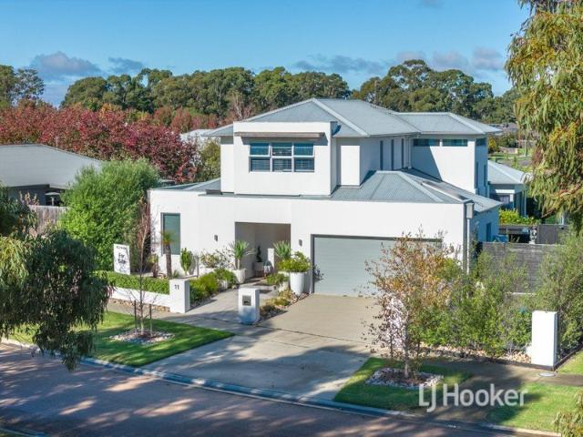 QUALITY BUILT LUXURY WITH RESORT STYLE LIVING OVERLOOKING TREED RESERVE