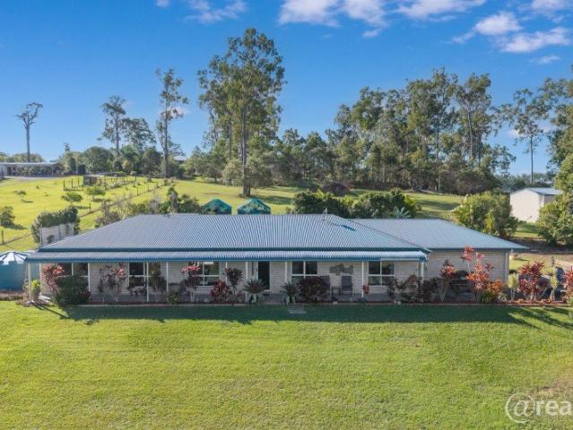Quality brick home on acreage, fenced + shed!
