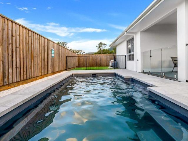 QUALITY, CUSTOM BUILT HOME WITH SIDE ACCESS IN PREMIERE ESTATE THE PALMS