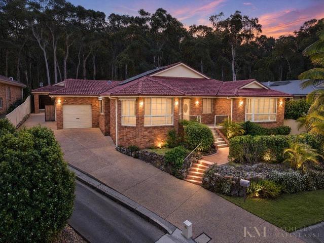 Quality Level Living with 3 Living Rooms & 4 Garage/Workshop