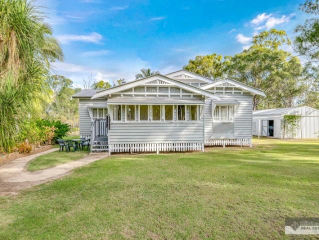 Queenslander Retreat Surrounded by Established Gardens on 5 Acres